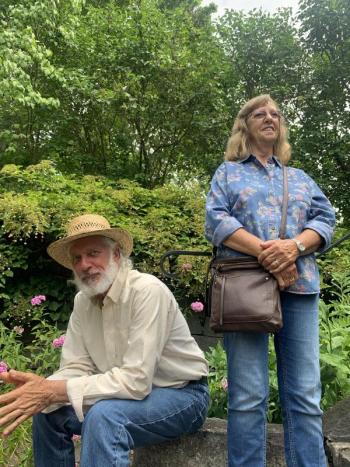 Steve and Carolyn Fife take in music in the Sunken Garden Aug. 18, the start of Schoonerfest in Wiscasset. SUSAN JOHNS/Wiscasset Newspaper