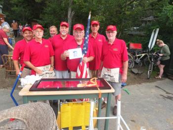 Southport firemen arrived early Aug. 20 to operate the morning yard sale which precedes the annual auction. From left, front are Jeff Brown, Bruce Joule, Steven Gaudette and Rob Cronk; back, Bruce Harris, Peter Cole and John Smith. BILL PEARSON/Boothbay Register