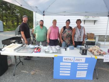 Southport Central School employees and volunteers sold a variety of baked goods and foods Aug. 21 during the annual firemen’s auction and yard sale. From left are Nick Ullo, Robbie Watts, Kim Burnham, Casey Martin and Lisa Clarke. BILL PEARSON/Boothbay Register