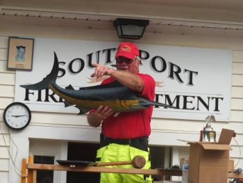 Since 1993, Gerry Gamage has been the auctioneer at the annual Southport firemen’s fundraiser. BILL PEARSON/Boothbay Register