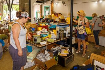 Looking over the yard sale offerings. Mike Leonard photo
