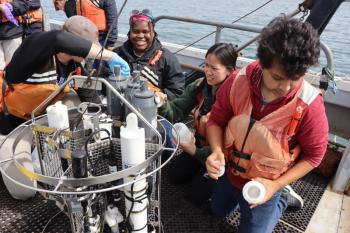 Undergraduates on a cruise collect samples. Courtesy of Bigelow Laboratory