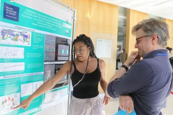 Brianna Mays, a rising senior majoring in marine biology at Maine Maritime Academy, shares her research at the poster presentation. Courtesy of Bigelow Laboratory