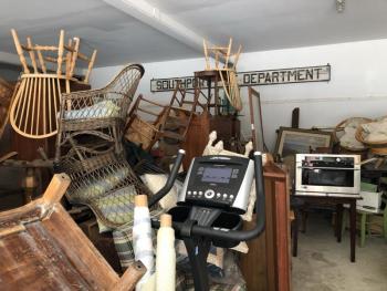 Today’s disorganized pile will, by 6 a.m. Saturday, Aug. 21, be sorted and ready for sale. JENNY BENNETT/Boothbay Register Donations to the fire auction