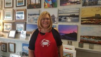 Susan Brown poses with some of her and Ed’s work. Courtesy photo