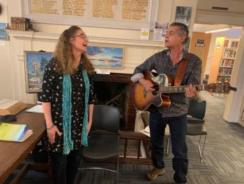 Author Lara Tupper and her husband Bobby Sweet sing Sept. 9 during her discussion at Boothbay Harbor Memorial Library. BILL PEARSON/Boothbay Register