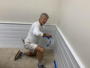 Rebuilding Together volunteer Jack Herger helps with Boothbay American Legion Hall interior painting. BILL PEARSON/Boothbay Register