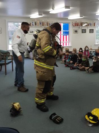 Fire Department member Taylor Lowery demonstrates his gear for the students. JANE CARPENTER/Boothbay Register