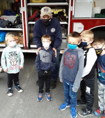 Paul Mayotte and grandson Gabe with members of the BRES kindergarten class. JANE CARPENTER/Boothbay Register
