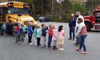 Chief Spofford greets the arriving BRES kindergarten class. JANE CARPENTER/Boothbay Register