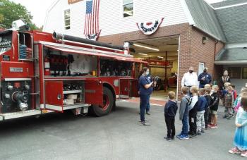Chantalle Arsenault explains items on a fire truck. JANE CARPENTER/Boothbay Register