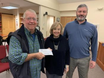 The Boothbay Region High School Class of 1971 donated its remaining $656.37 treasury to the Clifford Park Project following the class’s 50th anniversary this fall. On Oct. 26, class member Tom Nickerson, left, presents a check to Boothbay Civic Association member Dawn Gilbert, center. Also pictured, Town Manager Dan Bryer. BILL PEARSON/Boothbay Register
