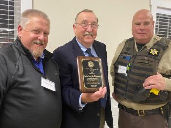 Sheriff Todd Brackett, left, and Lt. Brendan Kane, right, receive an award on behalf of Lincoln County Sheriff’s Office from Post Commander David Patch. Jim Singer photo