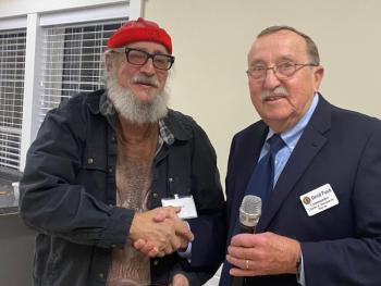 “Big Al” Cohen, left, receives a plaque from David Patch. Jim Singer photo