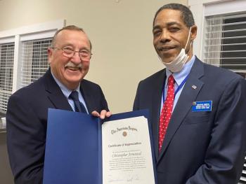 Chris Armstead, right, receives an award. Jim Singer photo