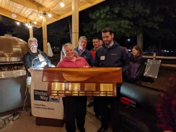 Bath Savings receives United Way’s Campaign Excellence Award. Co-chairs Megan Smith-Pinkham and Dan Wilson hold the Award, with fellow Bath Savings employees behind them. United Way Campaign Co-Chair Bob McCue is at left. Courtesy of Barbara Reinertsen