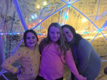 Igloo diners, from left, Grace Thornton, Eva Gilbert and Amanda Lord on Dec. 2. Gail Christopher compared it loosely to camping: Like a tent, the igloo has a zippered doorway. LISA KRISTOFF/Boothbay Register