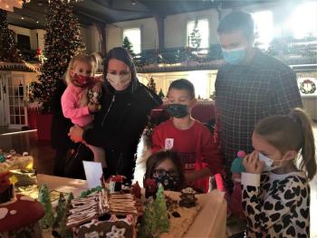 The Light family of Bangor also came to see Santa at Boothbay Railway Village and take in Gardens Aglow on Sunday. From left, Greta, Aimiee, Judah, Veda, Joe and Marina. LISA KRISTOFF/Boothbay Register