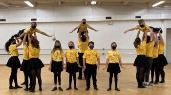 These 19 Y Arts performers, competing in the iTheatrics Junior Theater Festival the weekend of Jan 14, rehearse a number from “Madagascar Jr.” Emily Mirabile photo