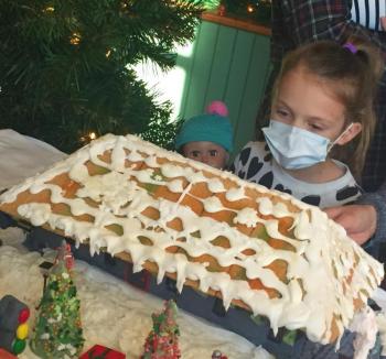 Marina and her bestie check out a gingerbread. LISA KRISTOFF/Boothbay Register