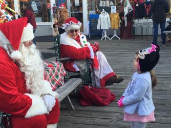 This young girl chose to speak to Santa and Mrs. Claus simultaneously - and did so with great charm. LISA KRISTOFF/Boothbay Register