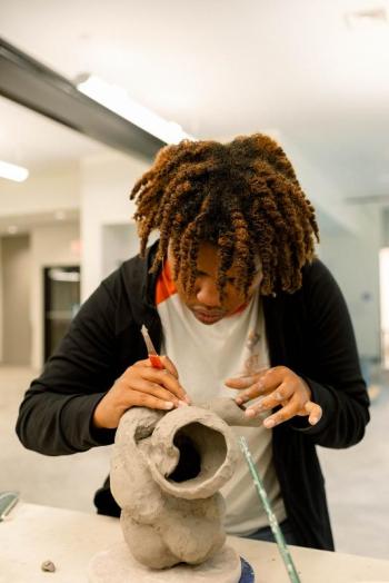 Artist Gerald Brown works on a piece during The Color Network’s 2021 Watershed residency. Courtesy of Claire Brassil