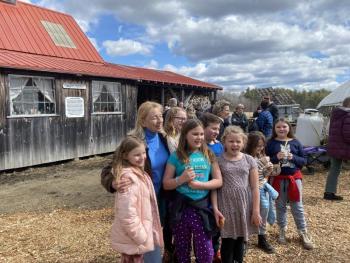 Gov. Janet Mills takes a photo with guests at Goranson Farm in Dresden March 27. Courtesy photo