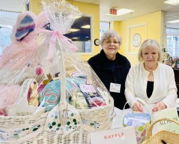 Volunteers Paula Endicott and Brenda Donovan tend to the Easter Raffle at Thrift Shop. Courtesy of St. Andrews Auxiliary