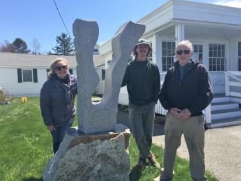 The recent addition to the Sculpture Boothbay trail, “Voyage” by Joseph DiMauro, center, was installed at Ocean Point Inn May 5. Also there were Sculpture Boothbay board members Patricia Royall and stone sculptor Bill Royall. LISA KRISTOFF/Boothbay Register