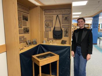 BRHS rising senior Grace Campbell shows her exhibit on Boothbay’s part in the Battle of Gettysburg. JOSEPH CHARPENTIER/Boothbay Register