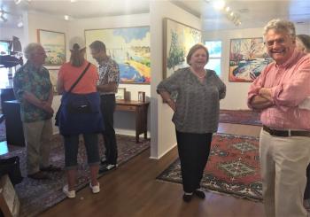 Gleason Fine Art saw a lot of action July 1 with two of its represented artists – Henry Isaacs (above, right) and Kevin Beers promoting their new shows. That’s Marty Gleason next to Isaacs. LISA KRISTOFF/Boothbay Register