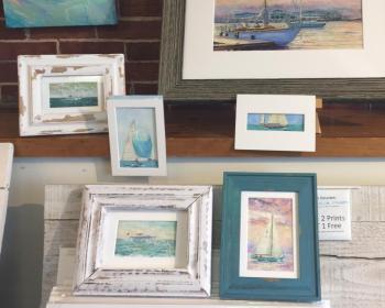 The small sailboat series by Ed Brown at his Wharfside Gallery on Commercial Street.