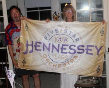 John and Carol Wells hold up the centennial banner. STEVE EDWARDS/Boothbay Register