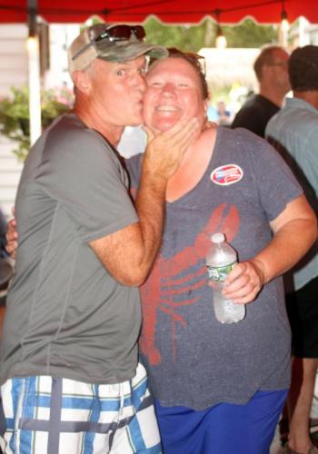 Brady’s owner Jennie Mitchell gets kissed. STEVE EDWARDS/Boothbay Register