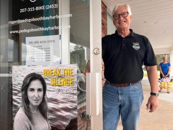 Roger Matthews, co-owner of Pedago Electric Bikes, said yes to shining a light on domestic violence survivors. Patrisha McLean photo