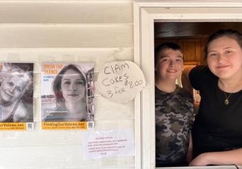 Nataleigh Haiden accepts an FOV poster at Karen’s Hideaway. Patrisha McLean photo