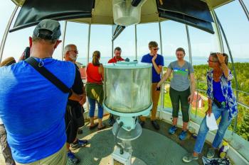 Photographers and tour guide in the Monhegan Lighthouse. Mike Leonard photo (www.phototourismbymike.com)
