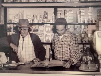 Richard Hodgdon, left, and son Stan behind the counter at the family store around 1960. Courtesy of Jennifer Gaudette