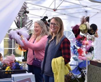 Jill Reynolds and daughter Heather have a good time checking out the chapeaus. LISA KRISTOFF/Boothbay Register