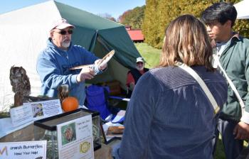 Learning about owl aviation with Dan Weekes and Willow L. Moon. LISA KRISTOFF/Boothbay Register