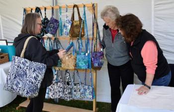 Lisa Tilton inquires about a handbag. LISA KRISTOFF/Boothbay Register