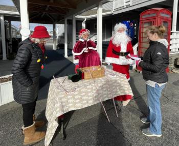 Santa and Mrs. Claus were at Brown’s with park committee members Nancy McEvoy, left, and Jen Field. Debbie Todte photo
