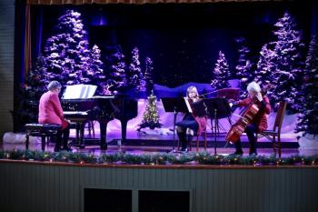 Genie O’Connell, Emily Barker and Kerry Jackson played on the final day of the Gingerbread Spectacular, Sunday, Dec. 18. Robert Mitchell photo