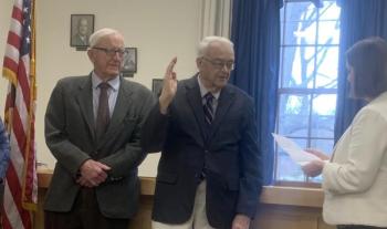 Maine Secretary of State Shenna Bellows, right, officiates over Commissioner Bill Blodgett’s swearing-in Jan. 3 at the county courthouse while Commissioner Hamilton Meserve, left, observes. BILL PEARSON/Boothbay Register
