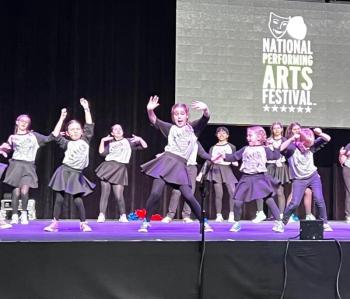 The Y Arts competition team performs a song from “Let’s Go to the Movies.” Courtesy of Emily Mirabile