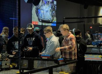 Kolton Campbell drives the robot while Afton Warren-Burdin makes suggestions during one of Saturday’s matches. Sebastian Warren-Burdin photo