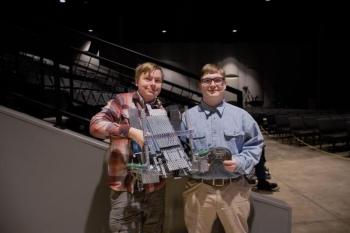 Afton Warren-Burdin, left, and Kolton Campbell display their 6th place finishing robot at the state championship. Sebastian Warren-Burdin photo