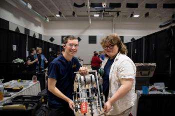 Matthias Fanslau, left, and Everett Howard show off the robot they built and used for the state championship. Sebastian Warren-Burdin photo