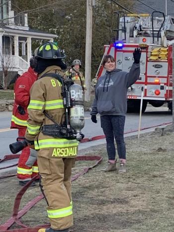 Kathleen Pearce, the “distraught mother,” points to her child banging on the window on the second floor of the house. KEVIN BURNHAM/Boothbay Register