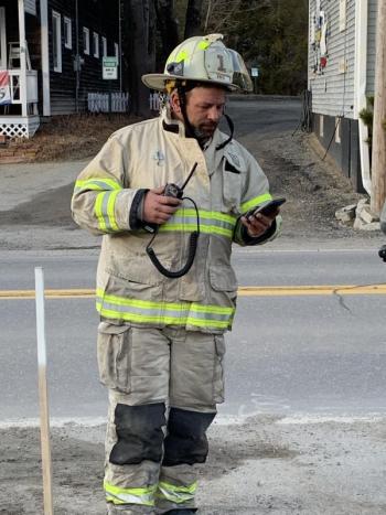 Boothbay Harbor Fire Chief Nick Upham makes the call to Lincoln County Communications to start the training session. KEVIN BURNHAM/Boothbay Register